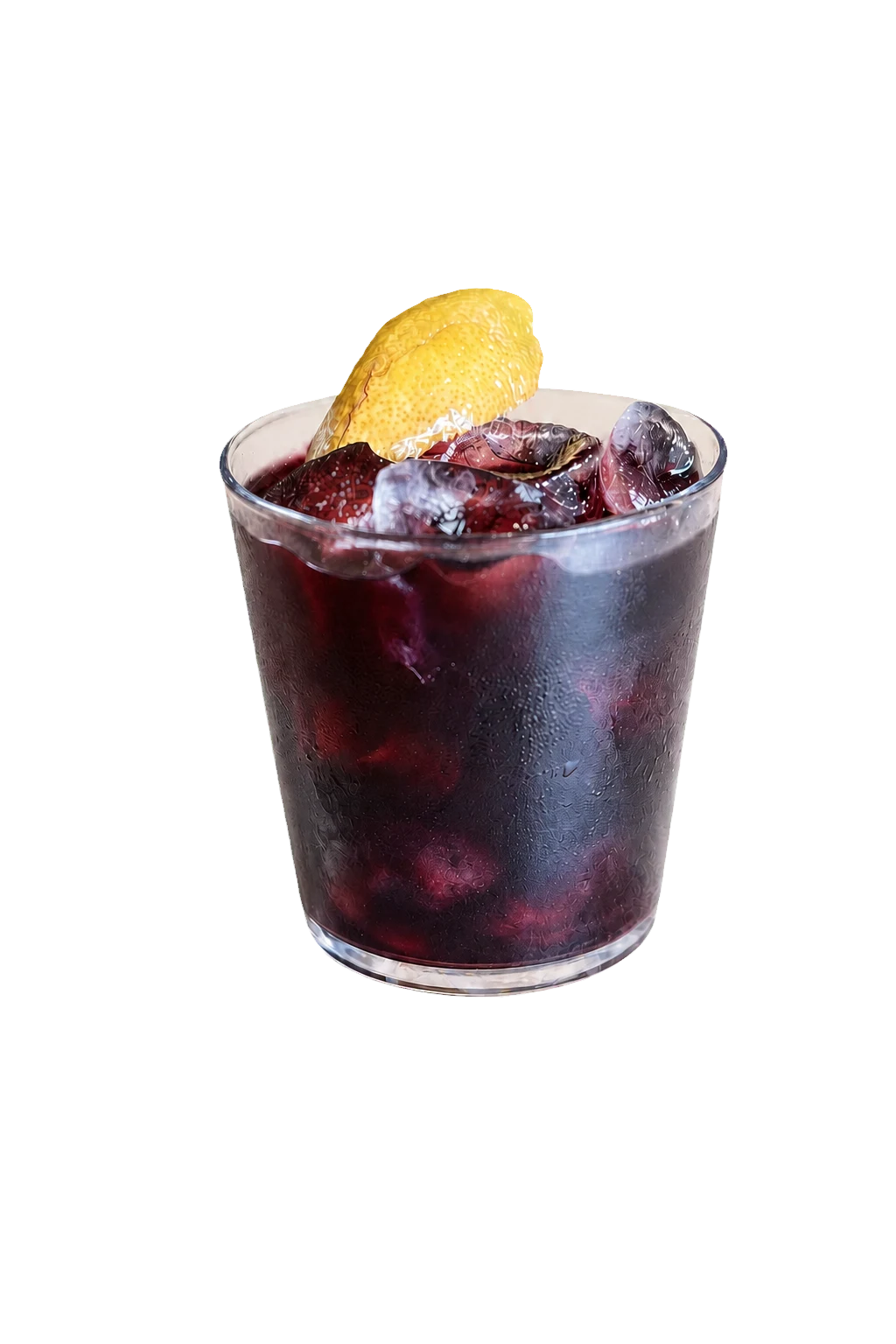 A deep-purple Spicy Blueberry mocktail with ice and a lemon peel.